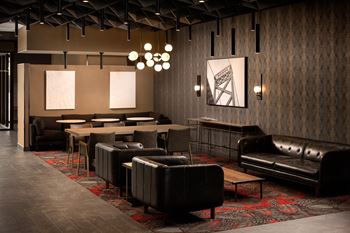 Lobby lounge featuring modern seating and abstract carpet